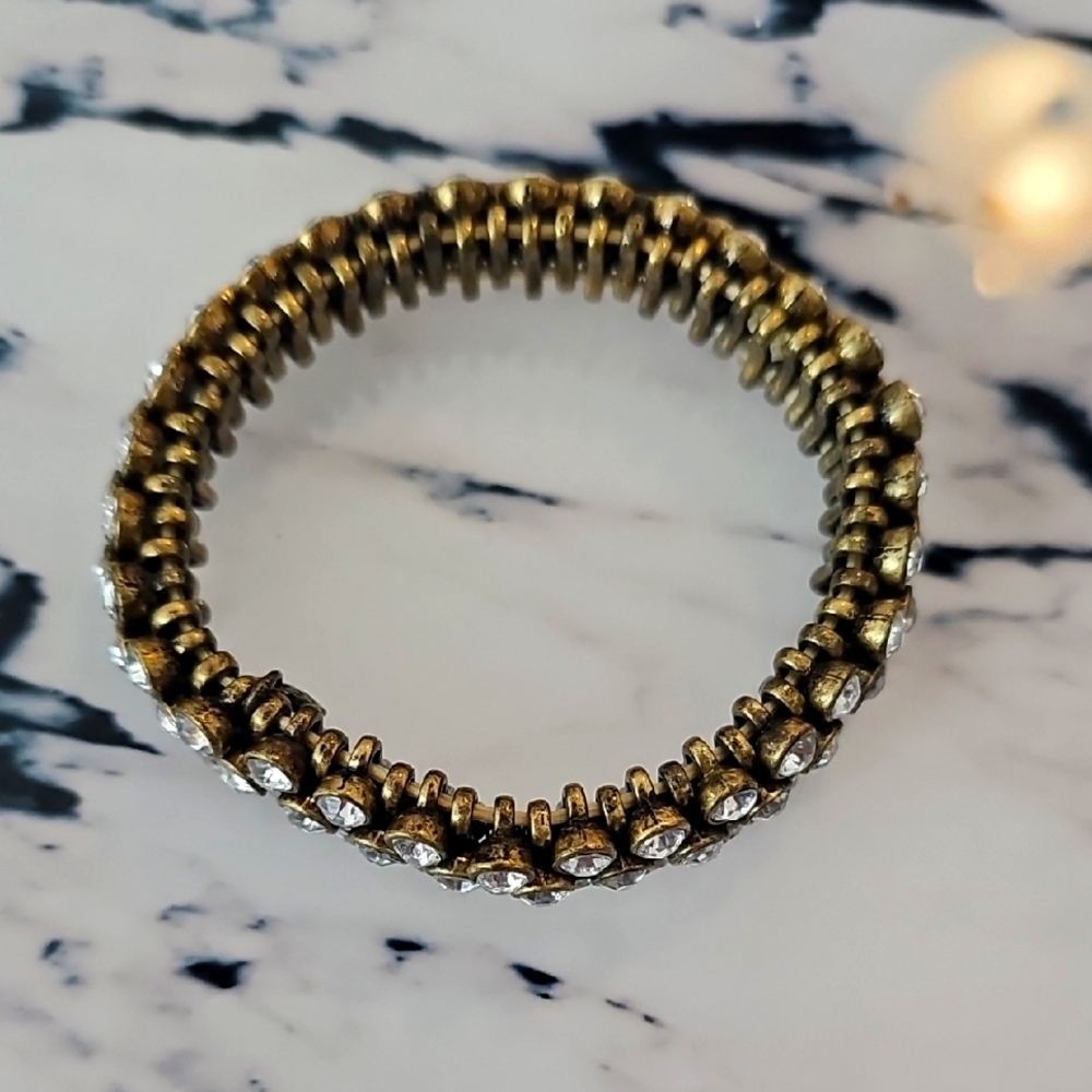 Gold J. Crew stretch bracelet with clear crystals